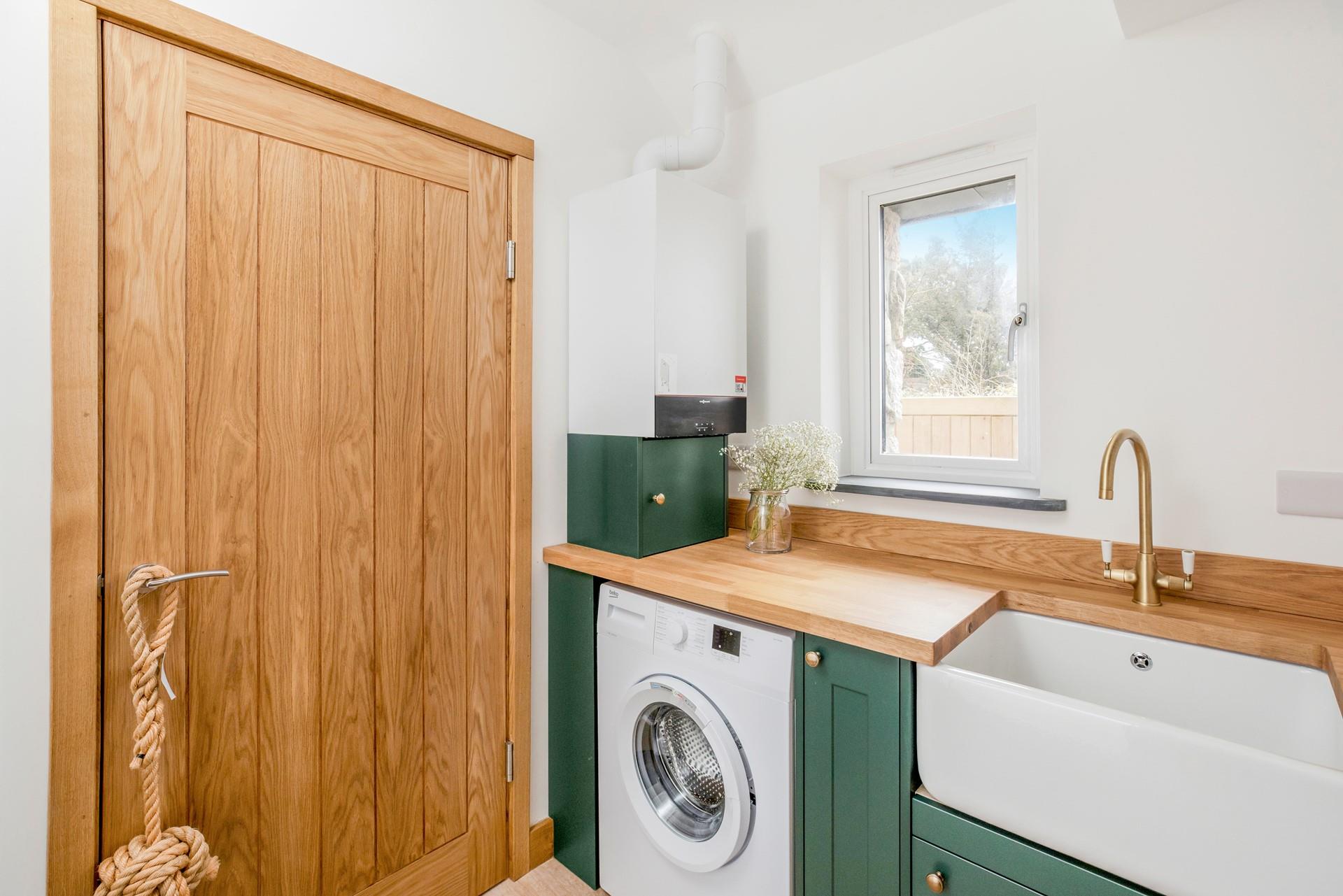 The utility room has a handy washing machine.