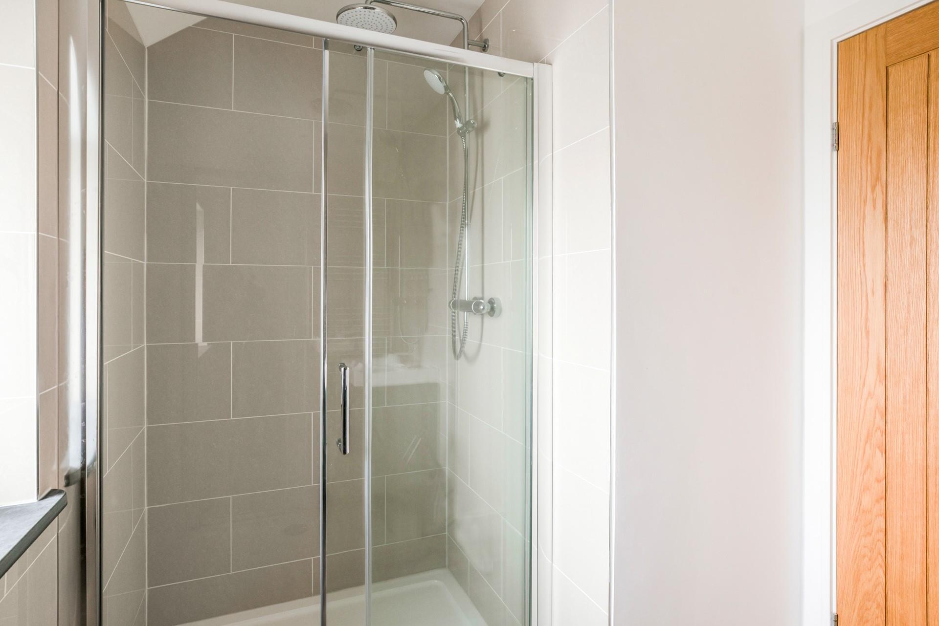 Wash off sandy toes in the shower after a day spent on the beach.