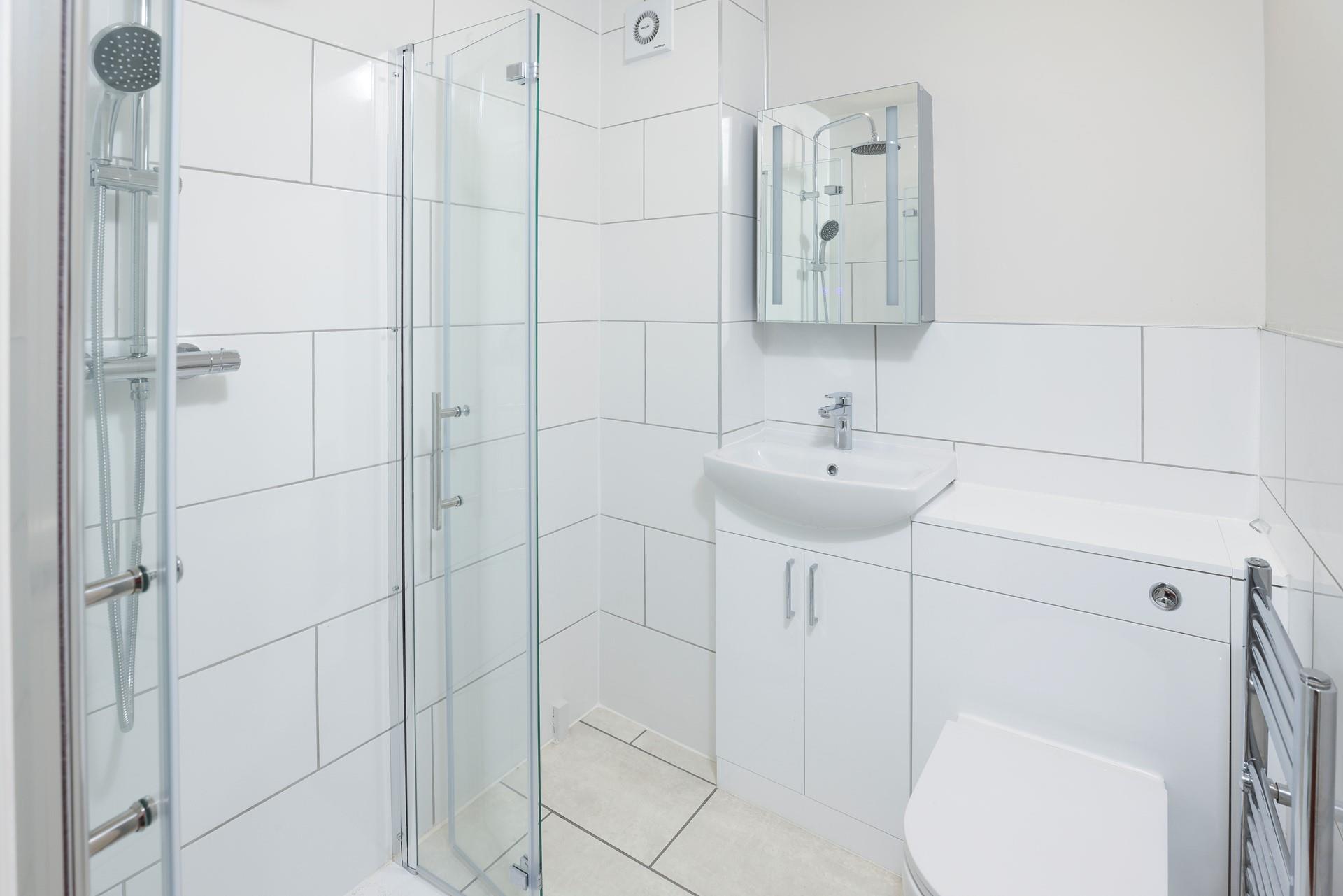 Wash the day away in the downstairs shower room after a coastal path ramble.