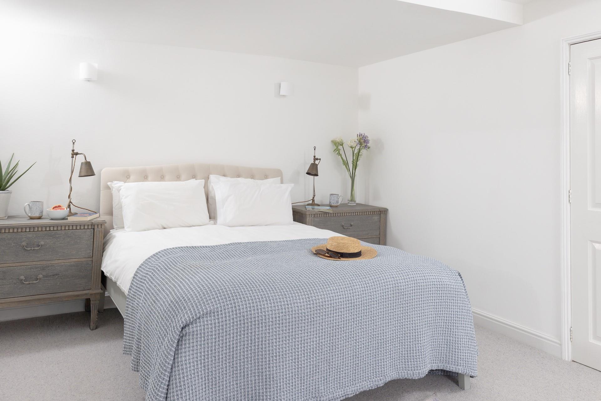 The bedrooms are decorated with lovely neutral tones and beautiful furnishings.