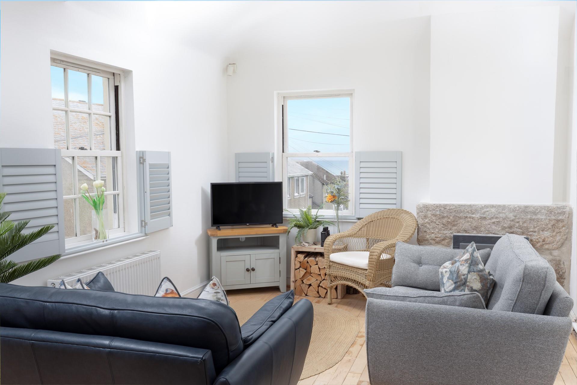 Sink into the comfortable sofas in the cosy and light sitting room.