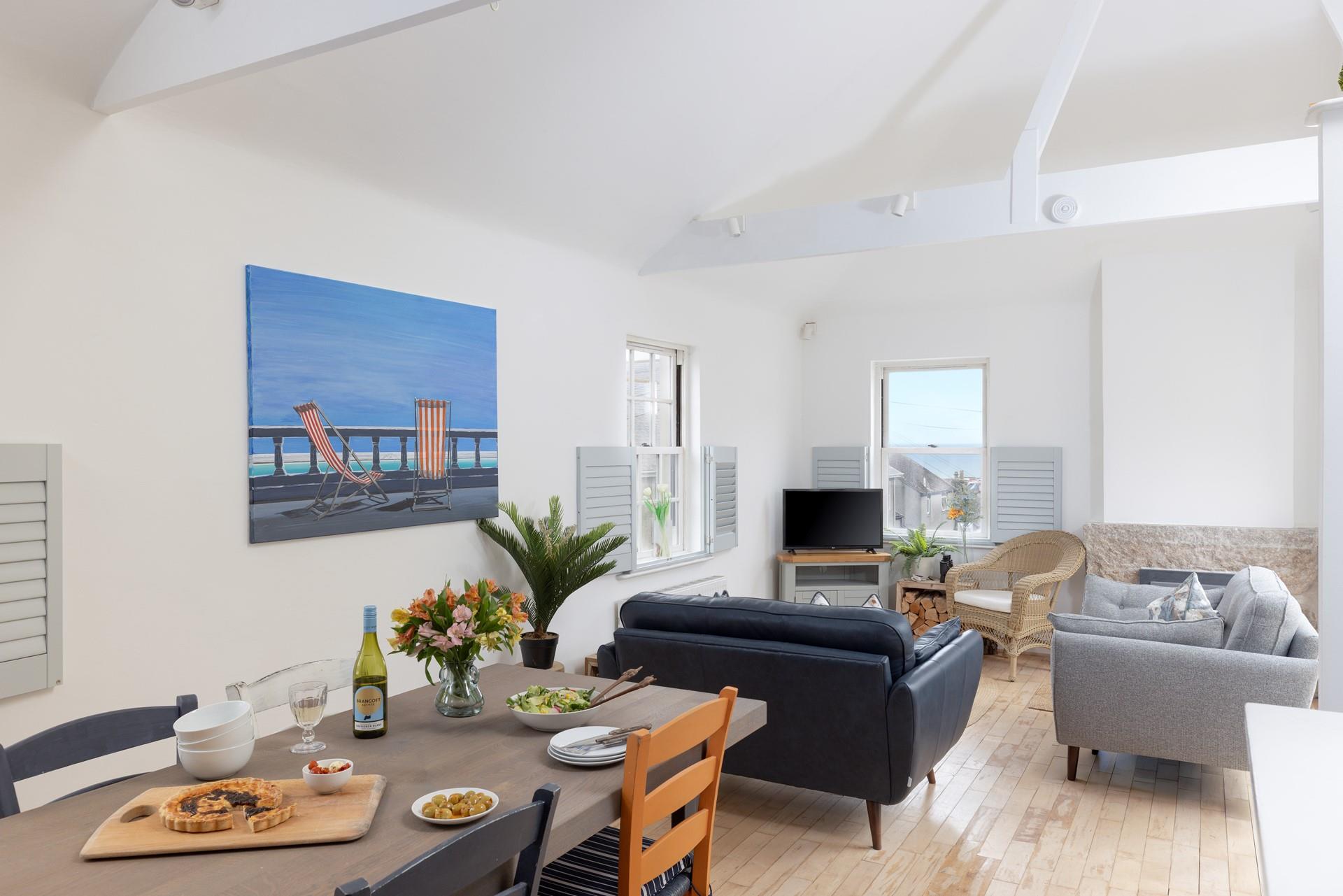 The open plan living area is a delightful area to dine and relax.