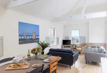 The open plan living area is a delightful area to dine and relax.