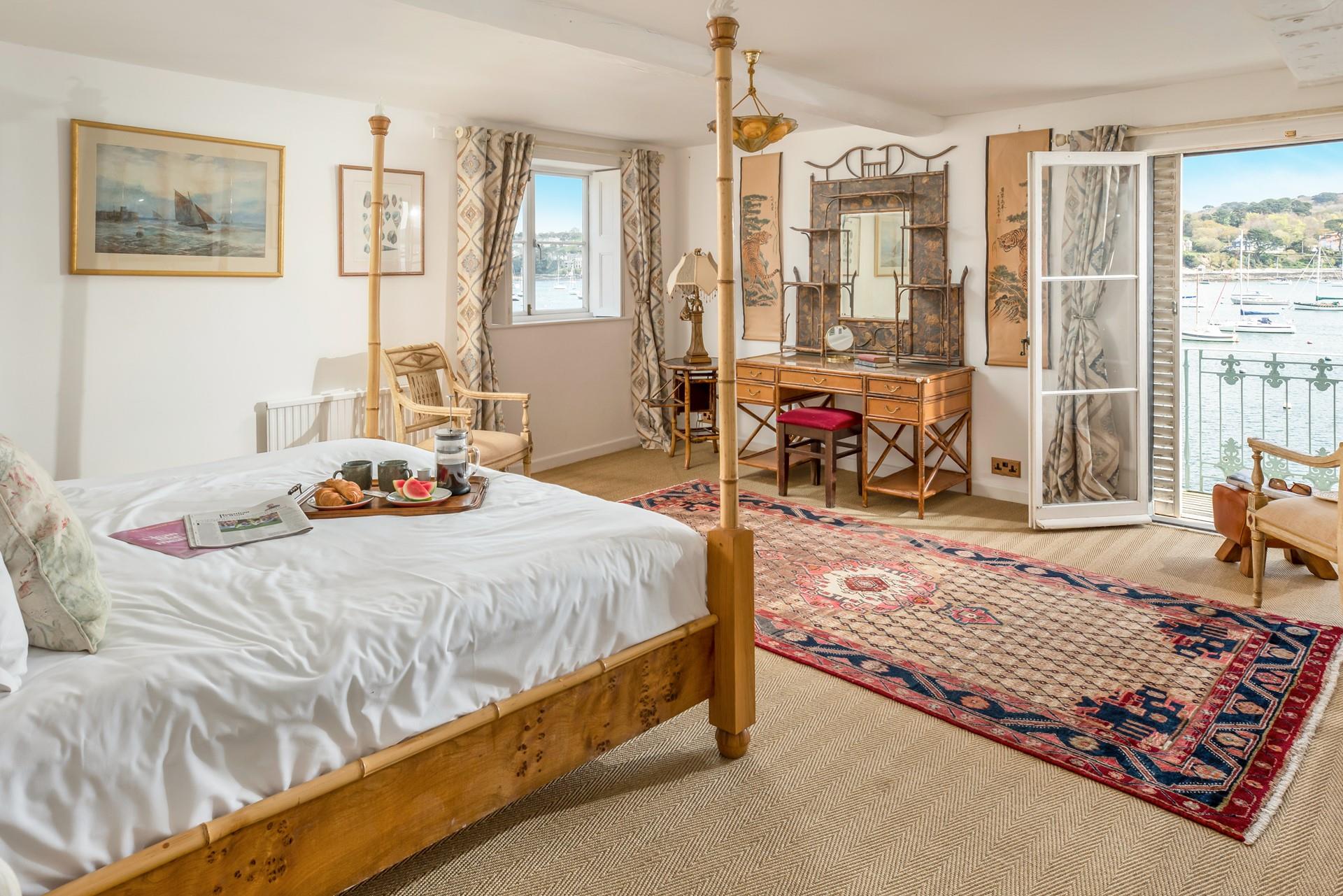 Wake up and draw back to curtains to see the sunrise over the boats.