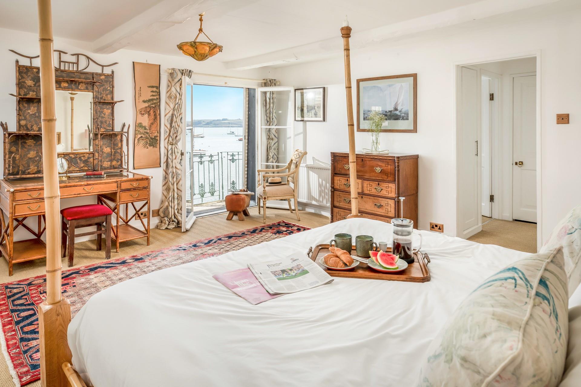 Open the doors and let the fresh summer breeze run through the bedroom.