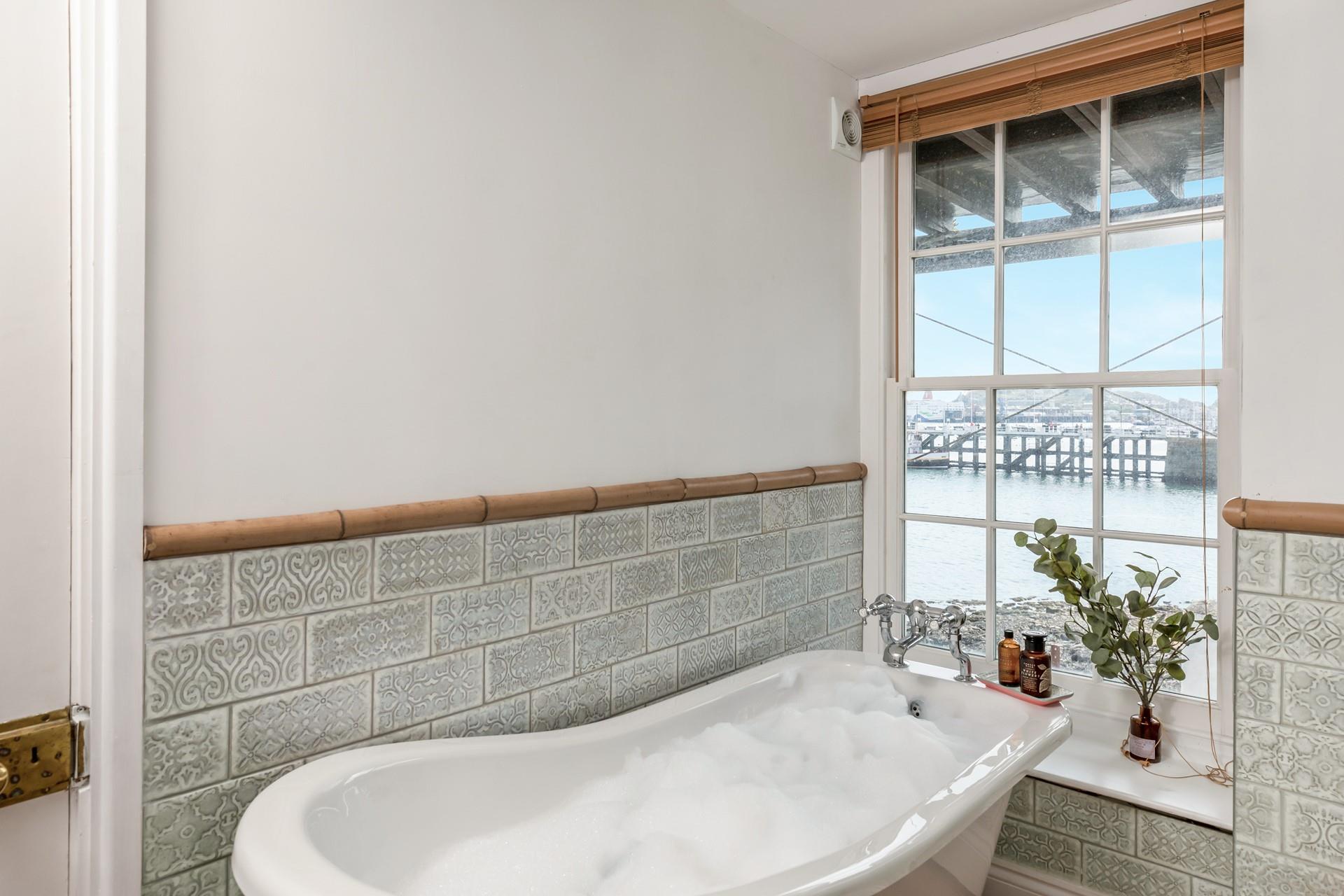 Soak in the bubbles whilst still taking in the sea views.