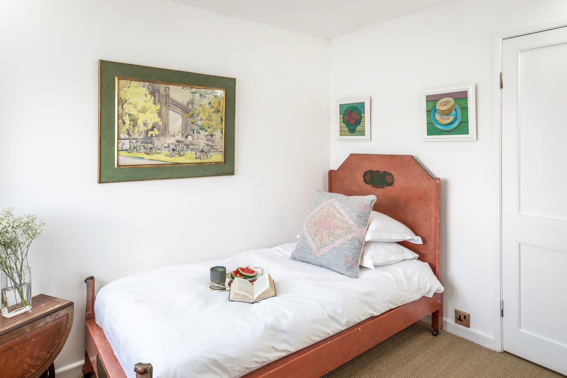 Bedroom 2 has a single bed with sea views.