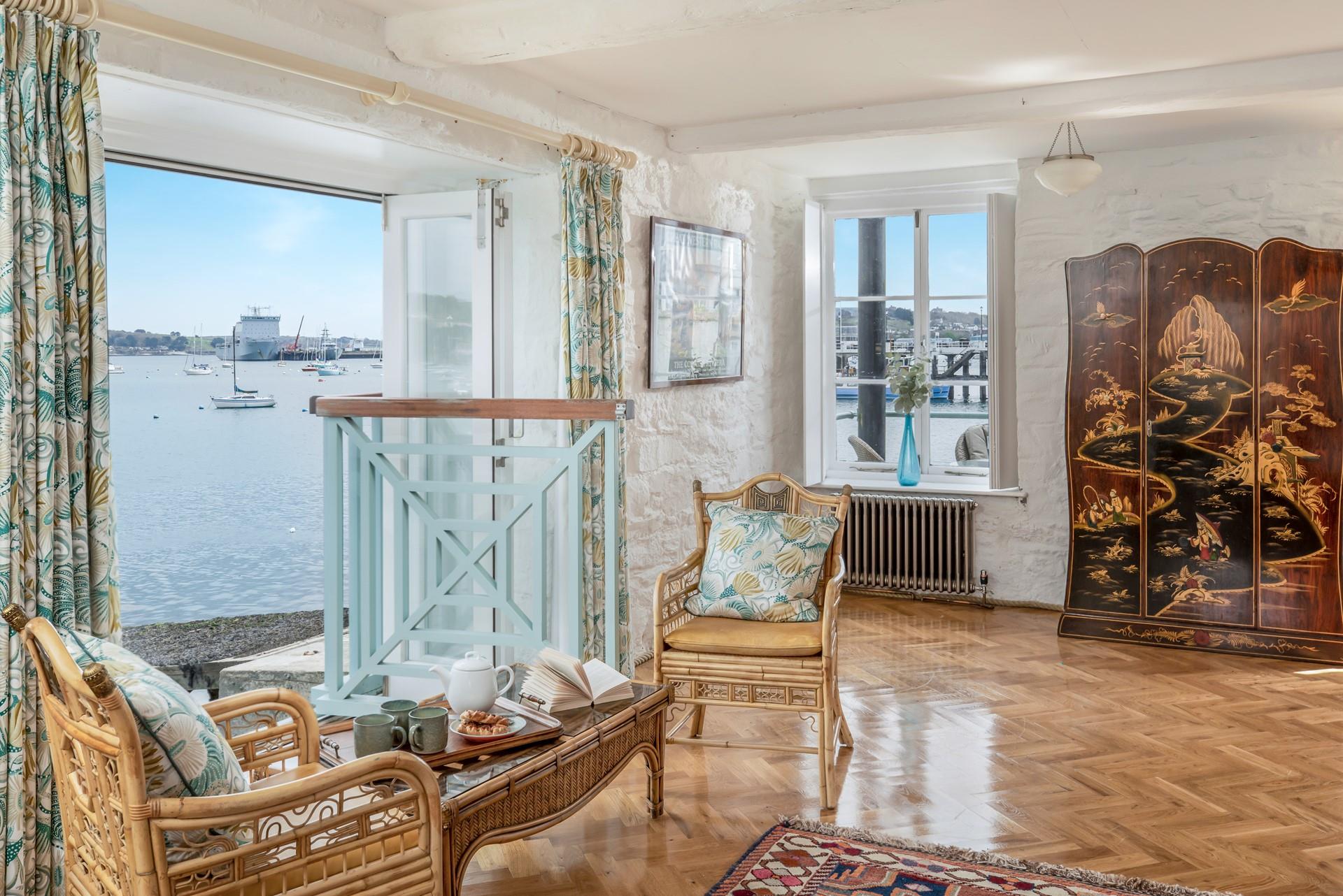 The balcony leads out to the outdoor dining area.