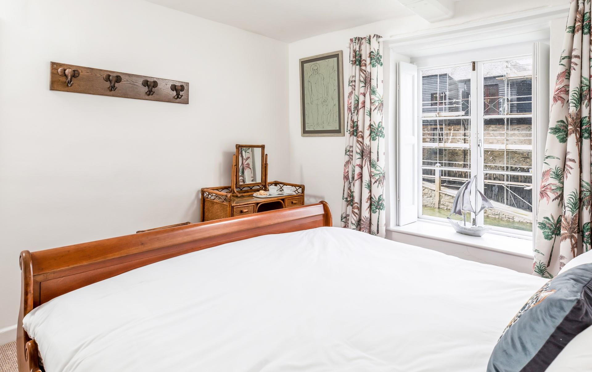 The tide ebbs and flows outside the bedroom window.