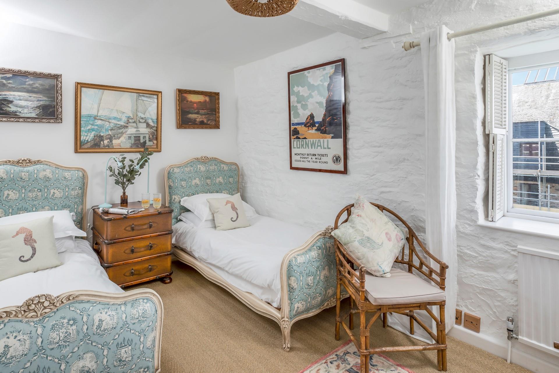 Bedroom 3 has elegant twin beds.