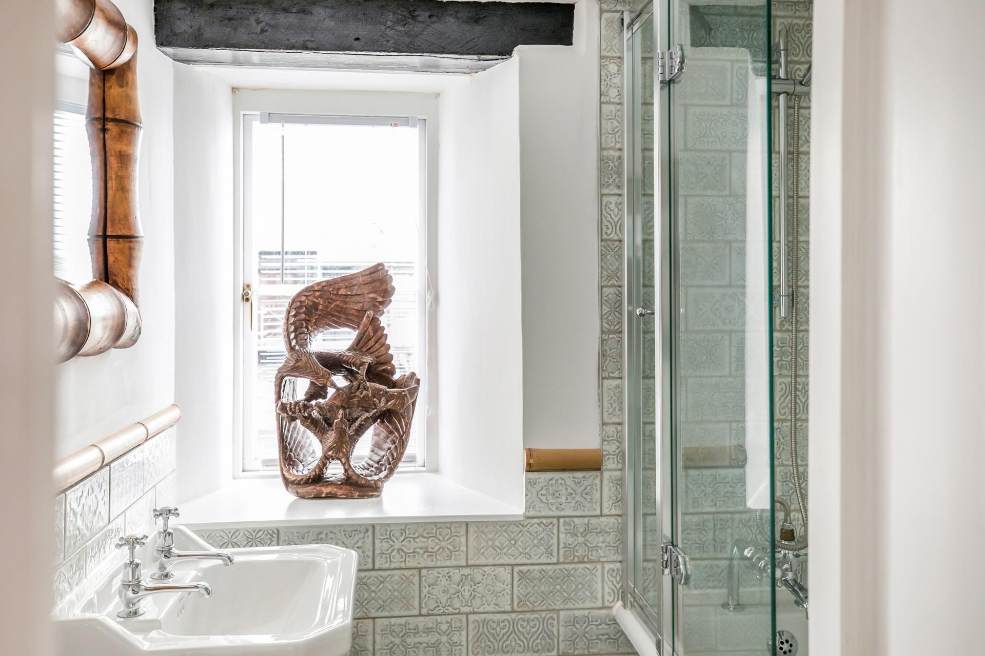 The bathroom has a bath with a shower over in addition to the en suites.