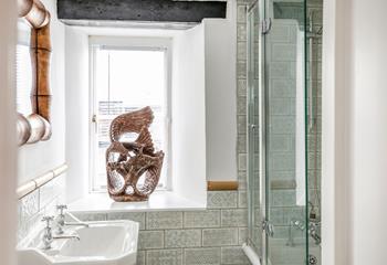 The bathroom has a bath with a shower over in addition to the en suites.