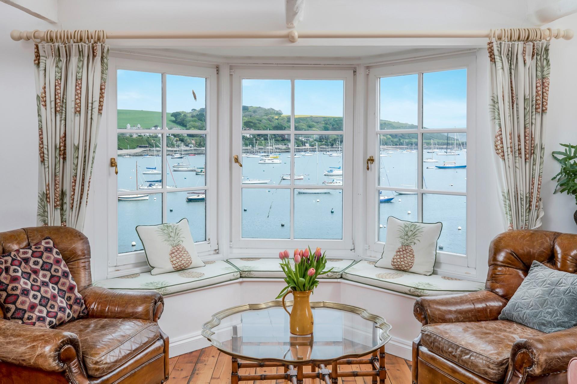 Watch the boats bobbing on the water from the large window.