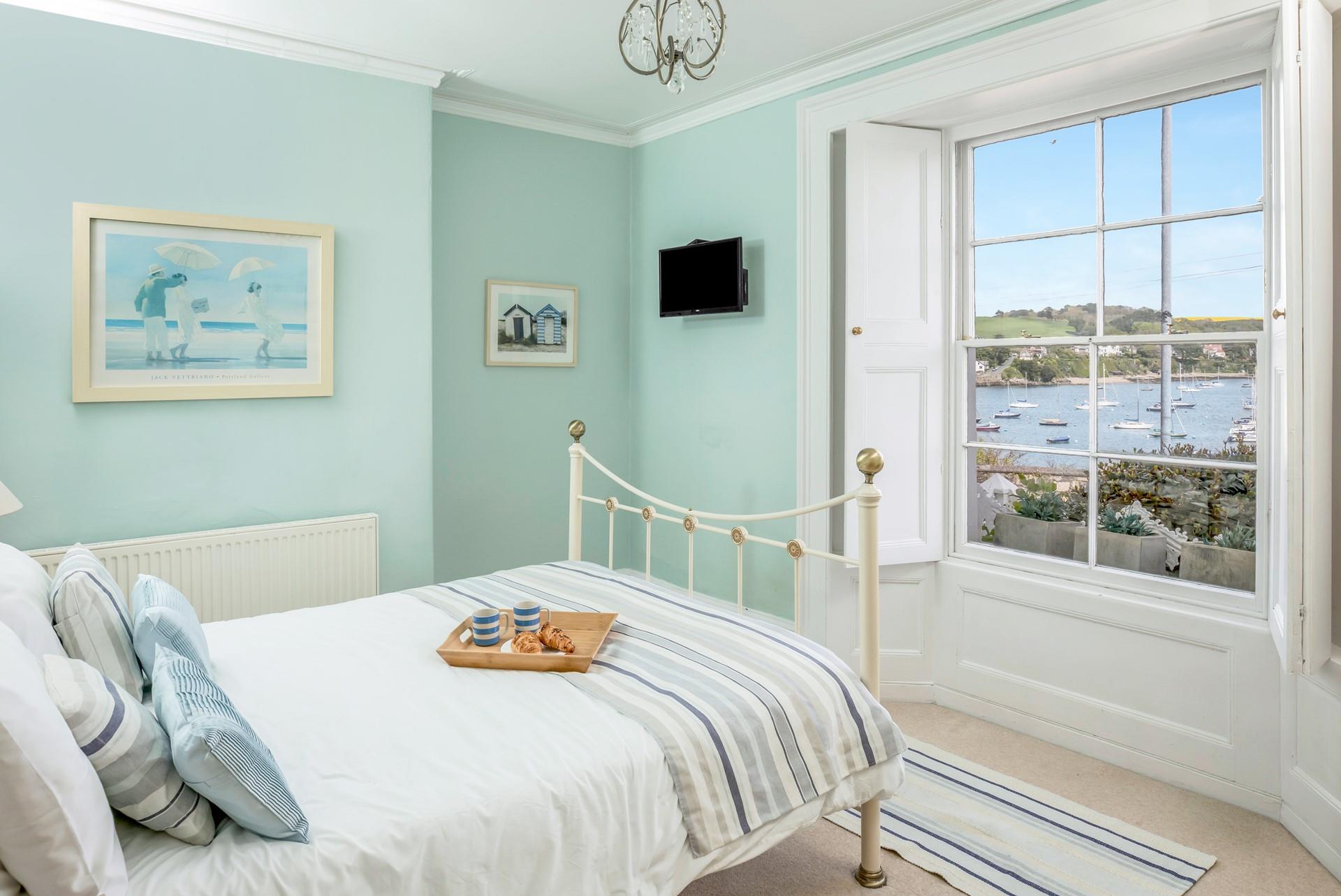 Bedroom 1 has a double bed and idyllic harbour views to wake up to.
