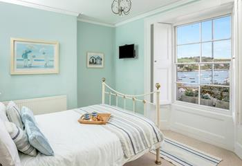 Bedroom 1 has a double bed and idyllic harbour views to wake up to.