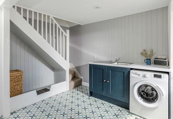 The utility area provides a useful space for washing.