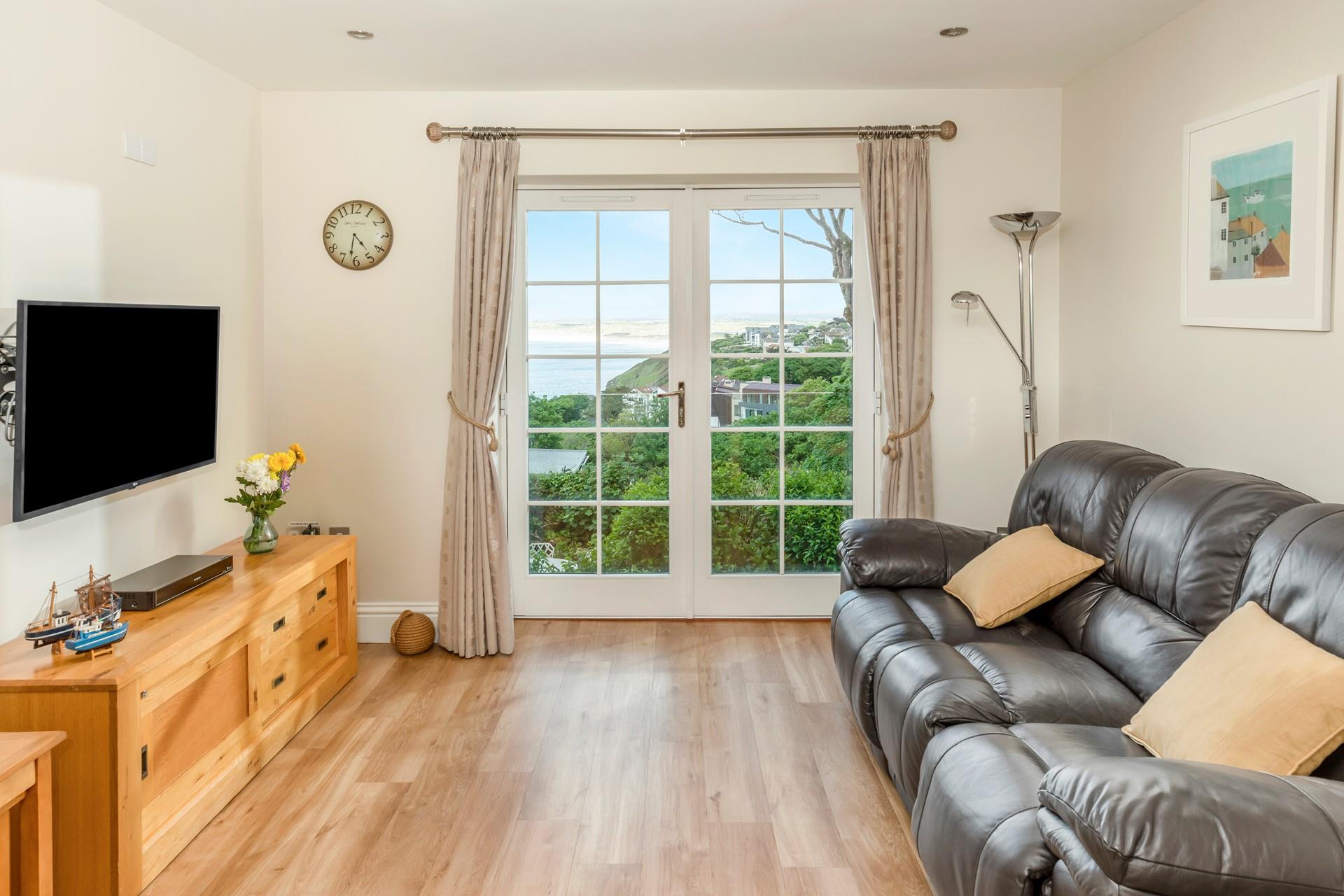 Sink into the sofa and enjoy the coastal views after a day of exploring.