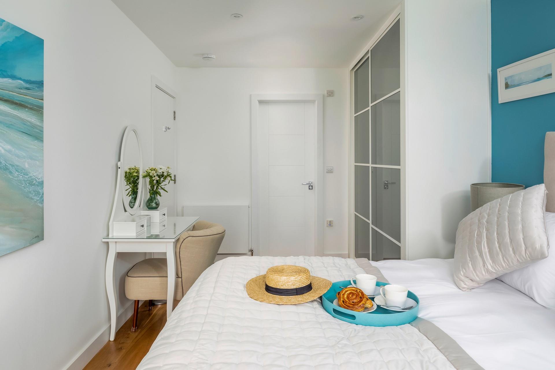 Beautiful sea blues adorn the bedroom!