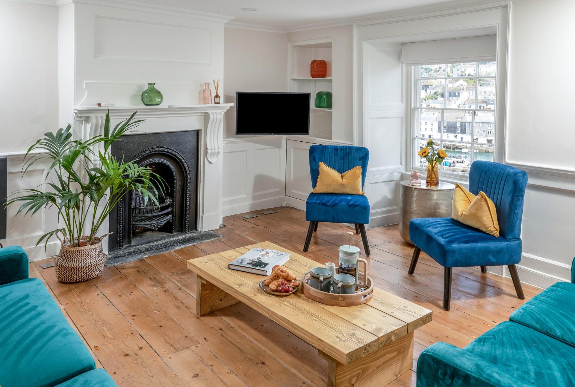 The stylish sitting room offers stunning views of the harbour.