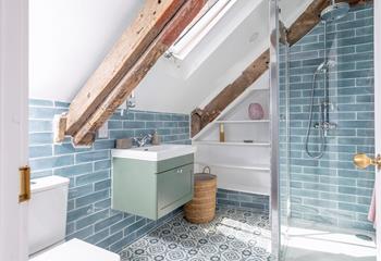 The stylish en suite has a shower perfect for washing off sandy toes.