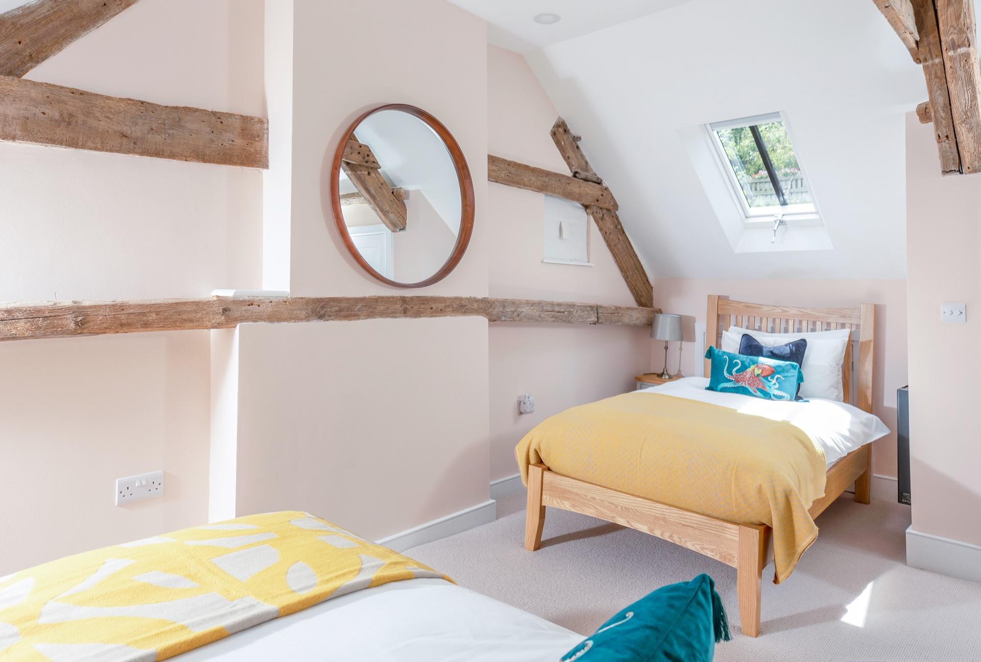 The twin beds offer flexible sleeping arrangements.