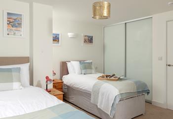 The twin beds offer a relaxing space to rest each night.