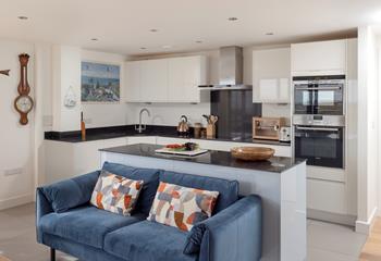 The kitchen is modern and well-equipped for cooking tasty meals.