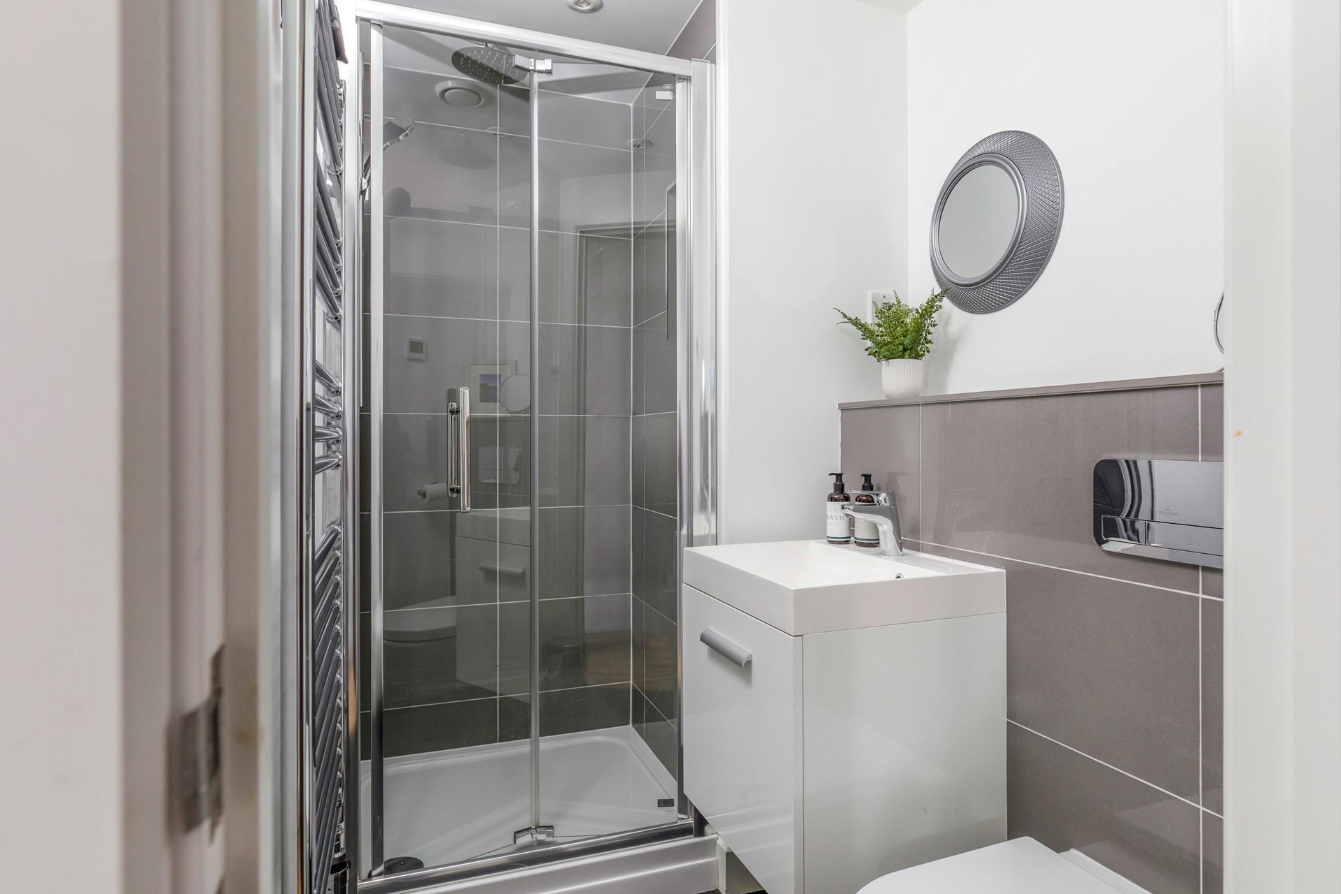 Wash off sandy toes in the shower after spending the day on Carbis Bay beach.