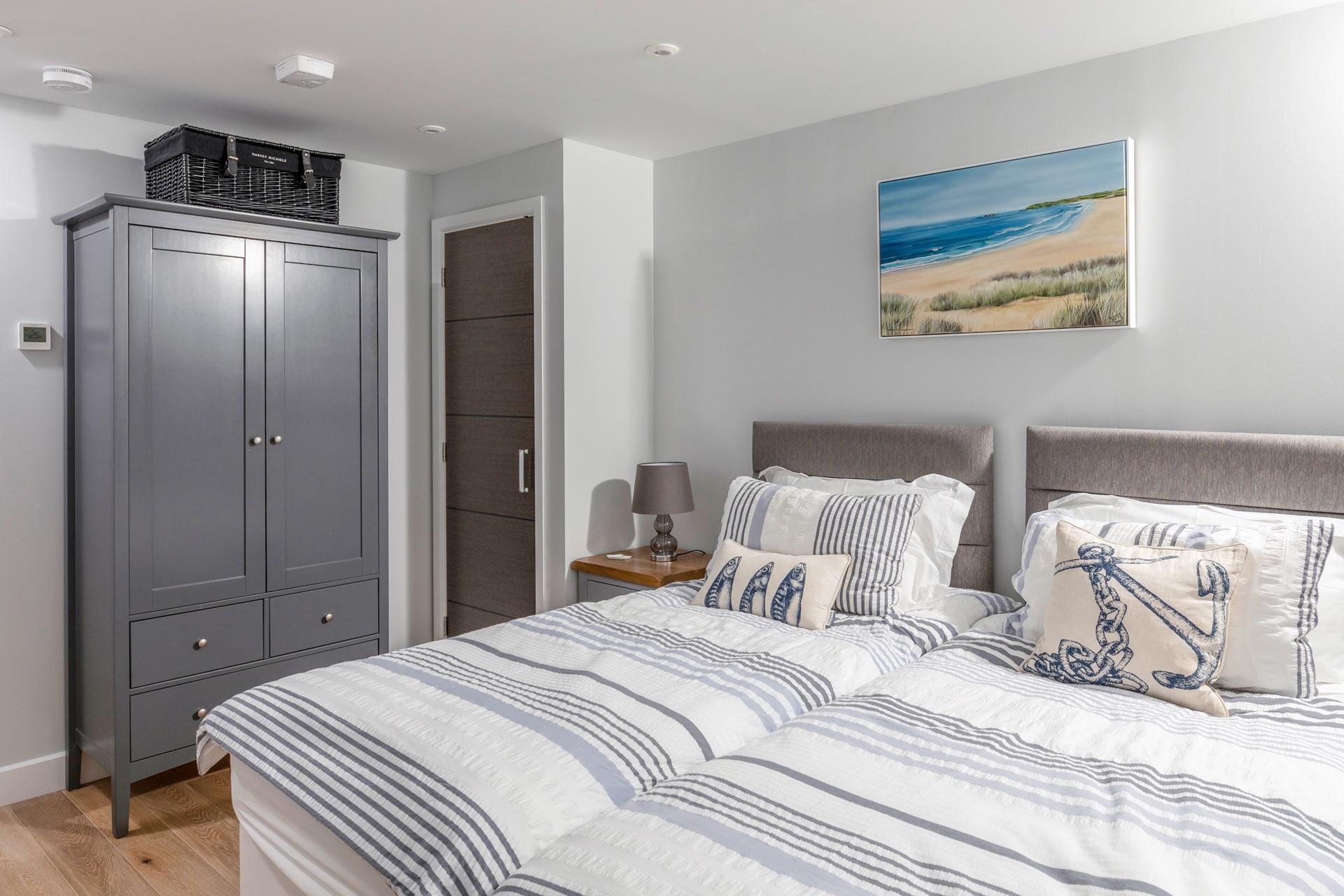 Seaside decor awaits in bedroom 2.