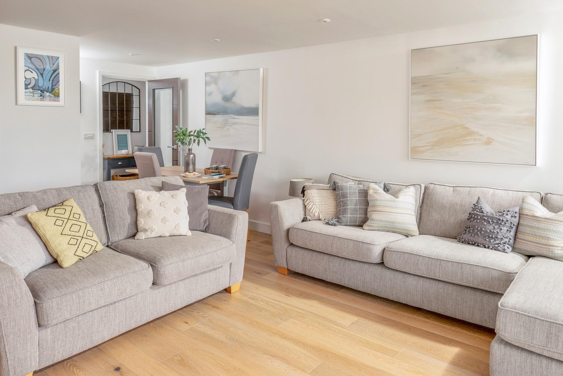 The apartment is decorated with stylish coastal decor.