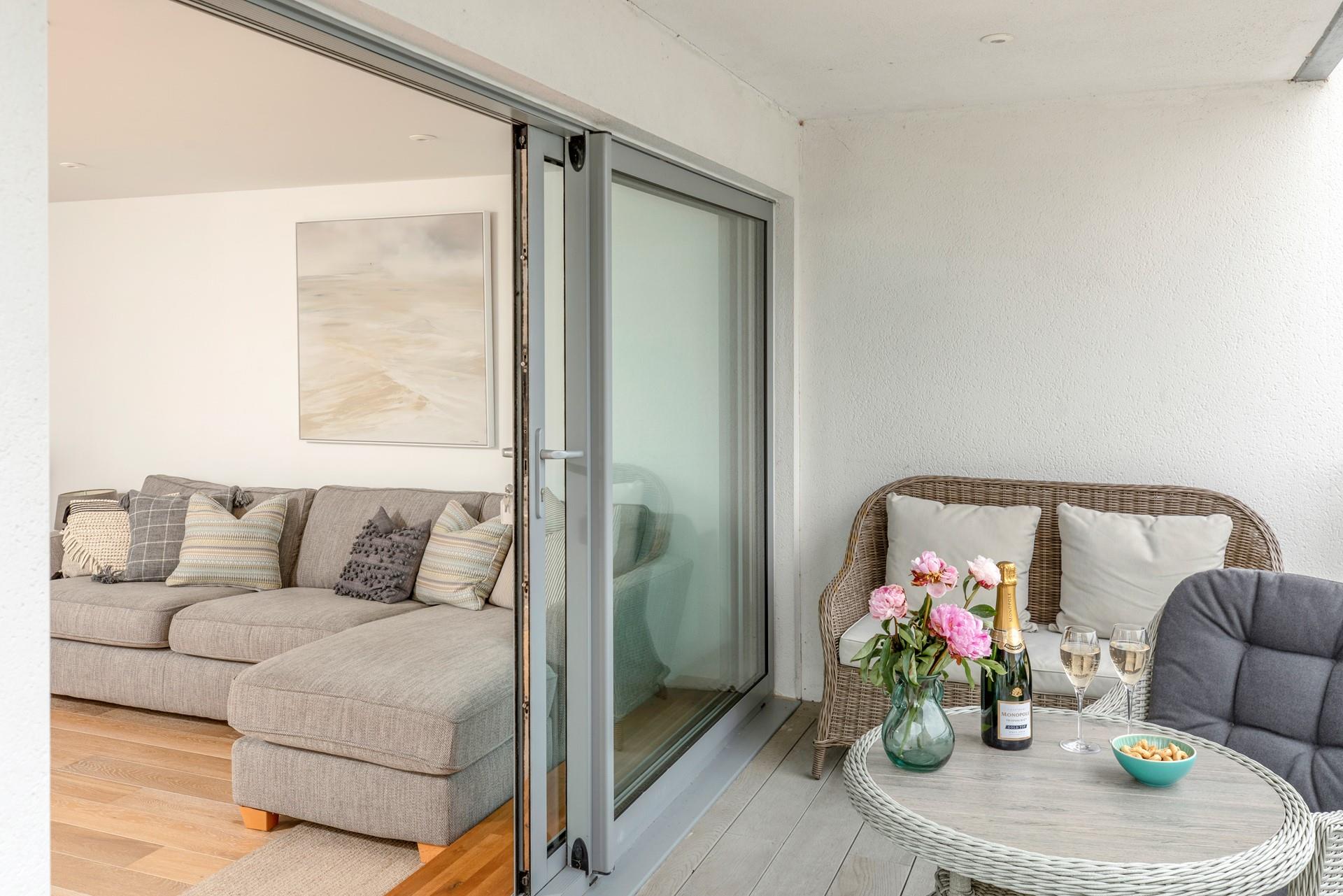 Tuck into nibbles and drinks on the balcony.