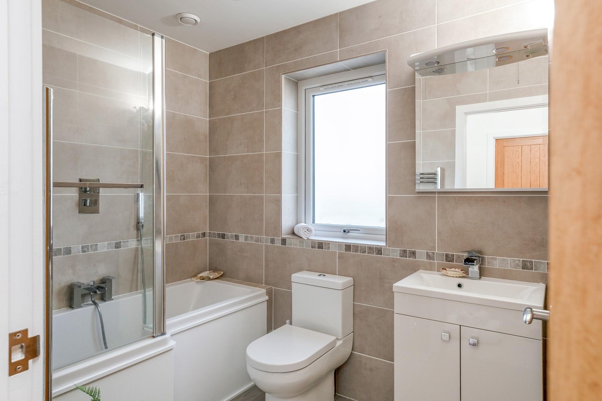 The bathroom gives you a choice between a relaxing bath or an invigorating morning shower.