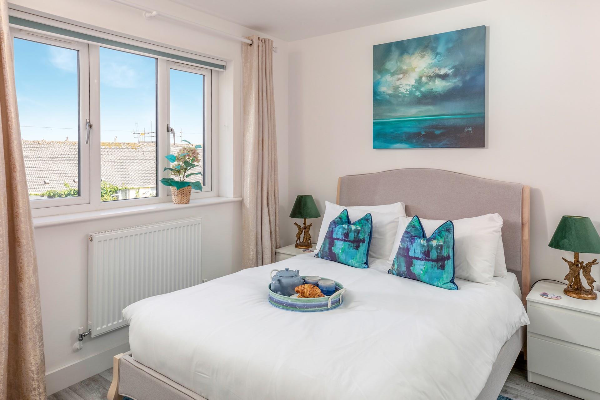 Bedroom 3 has a double bed and is tastefully furnished.