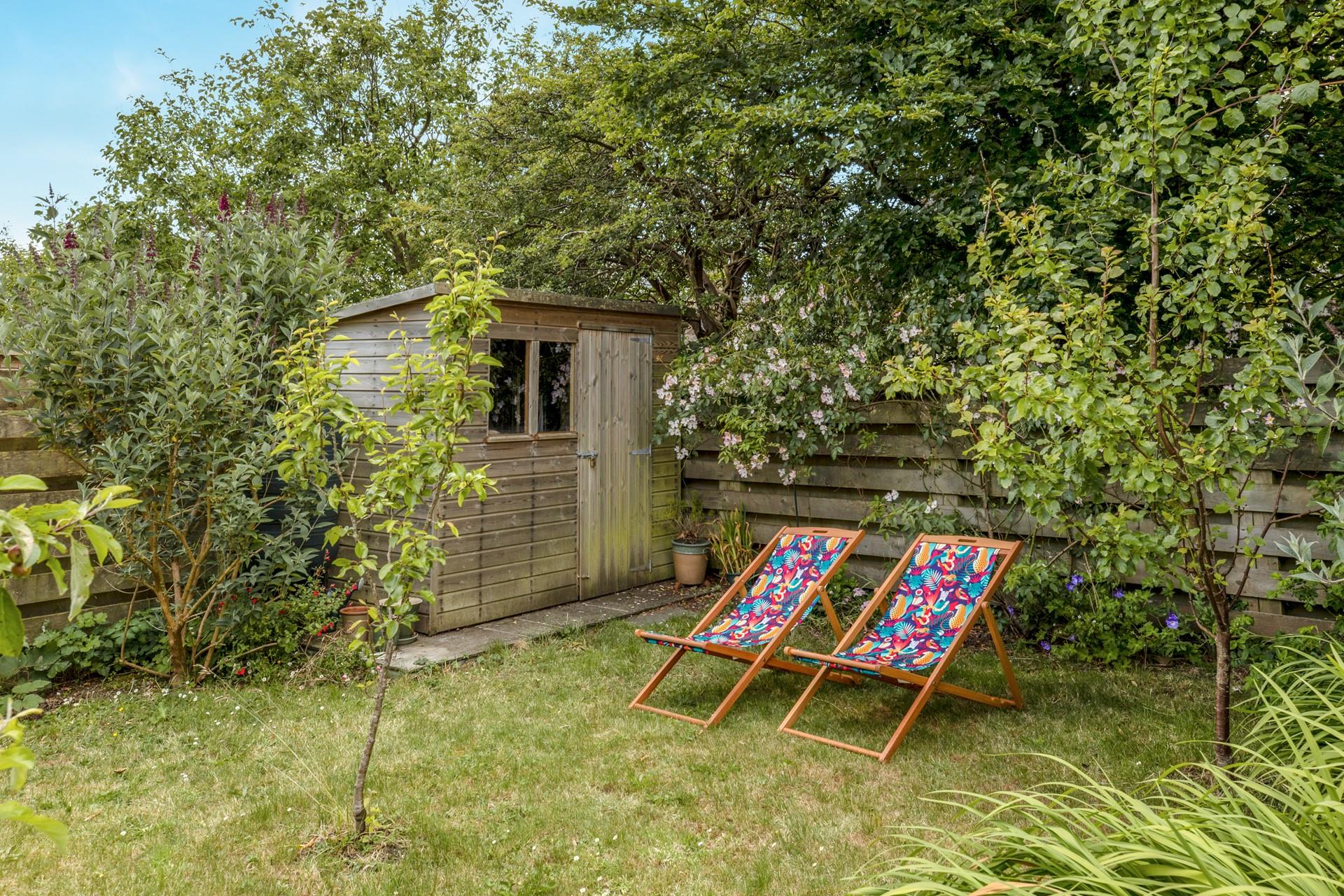 The back garden is ideal for watching the little ones play.