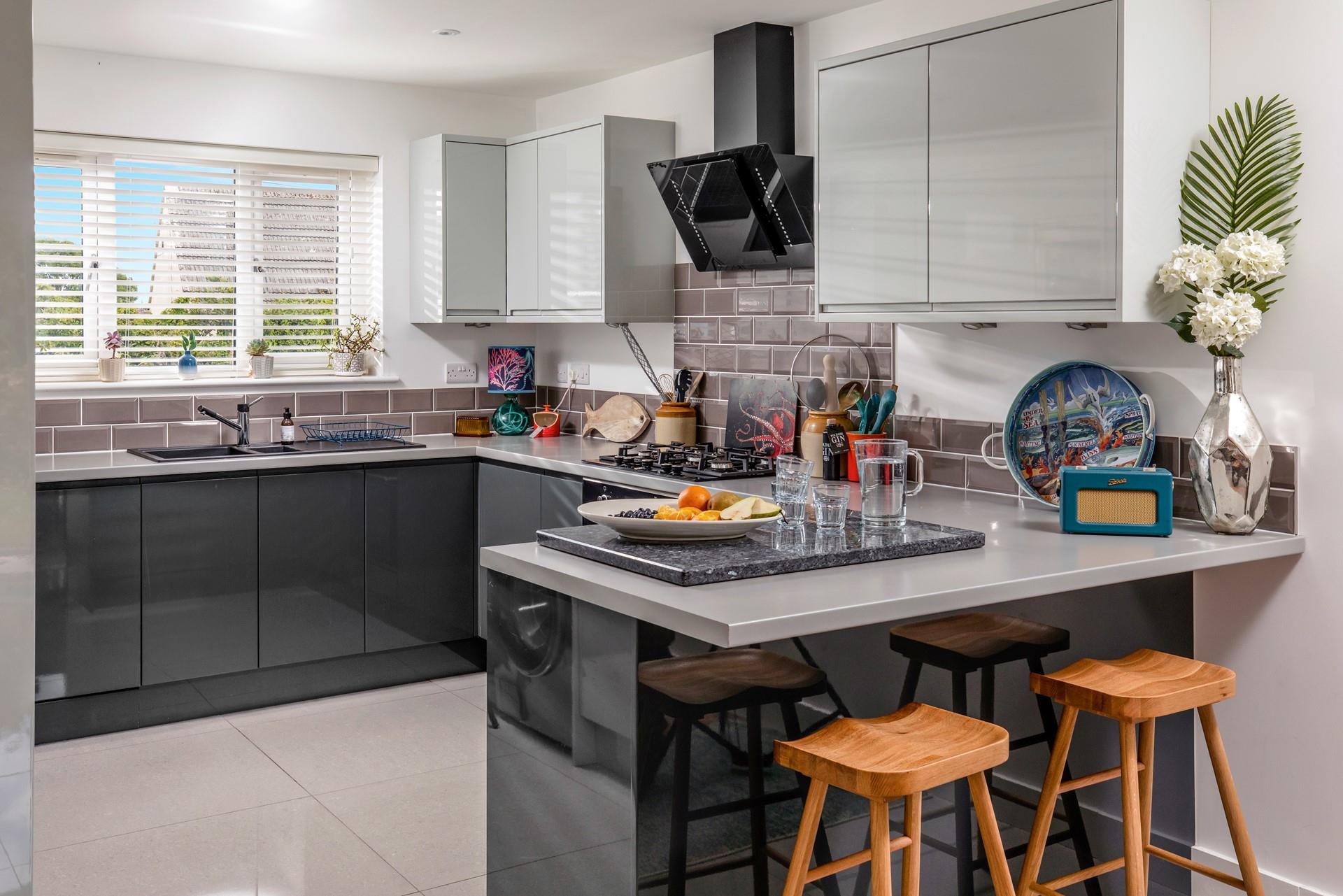 The kitchen is stylish and well-equipped for preparing meals.