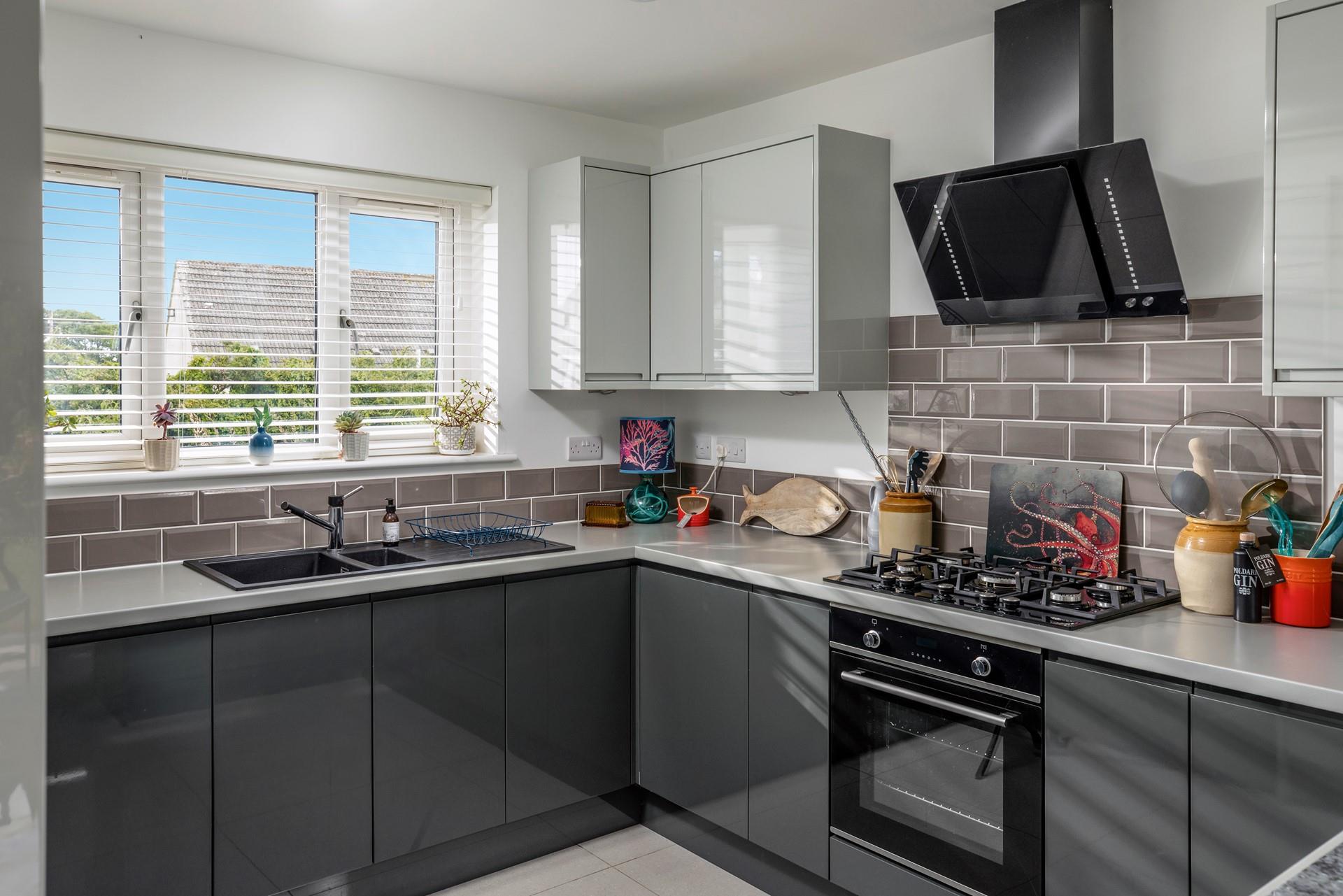The kitchen is modern and sleek, a dream to cook in!
