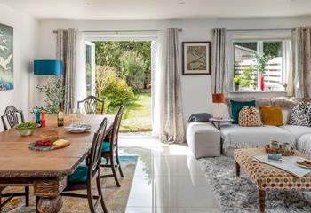 Open the patio doors and let the warm summer breeze into the stylish open plan living area.