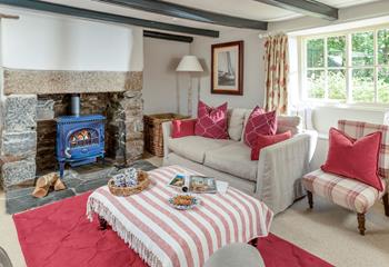 The cosy sitting room is ideal for winter nights in front of the fire.