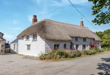 An idyllic escape awaits at this thatched cottage.