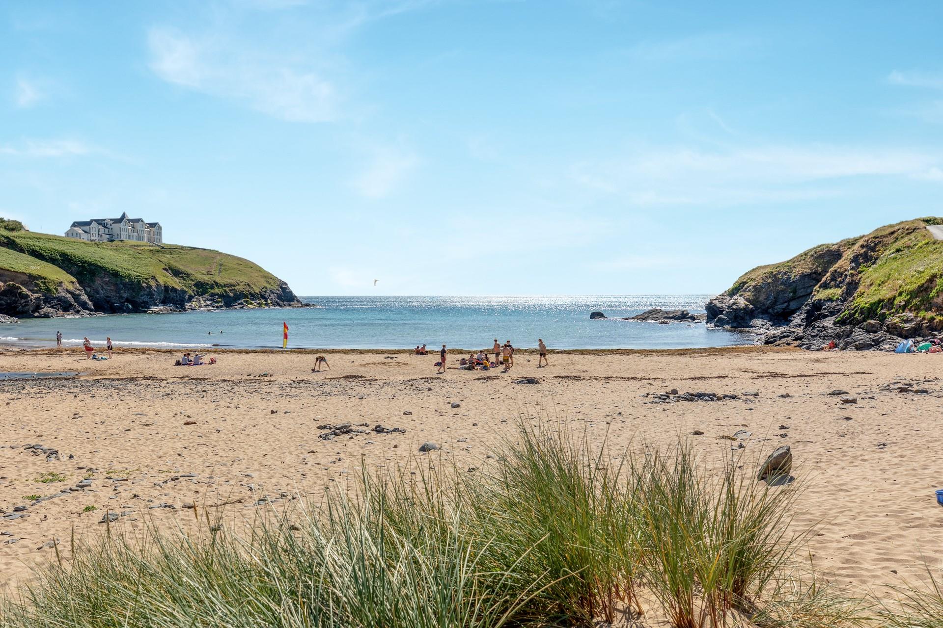 Take a morning dip in the calm waters of Poldhu Beach.