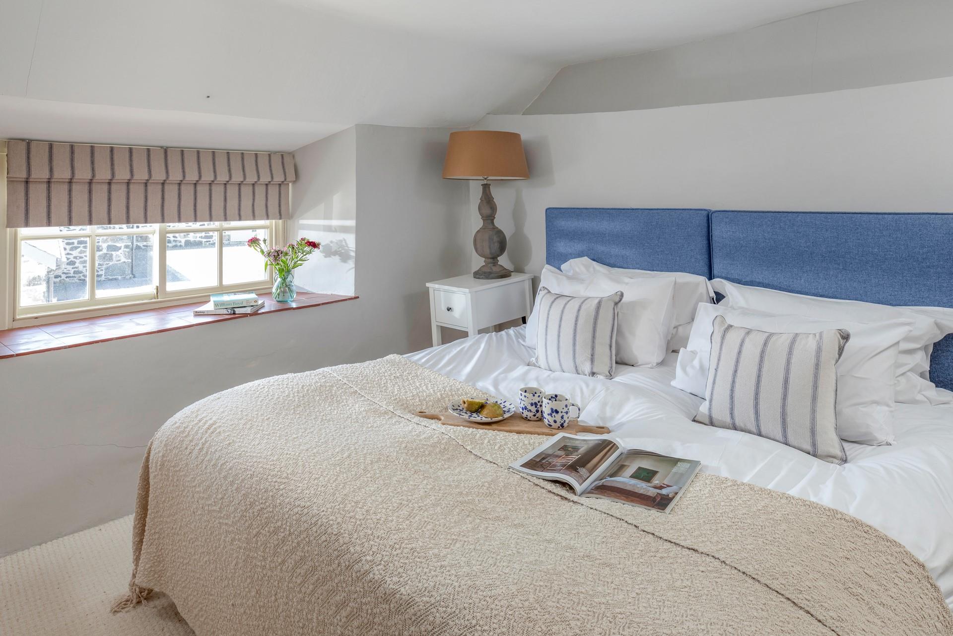 The bedrooms are decorated with seaside blues.