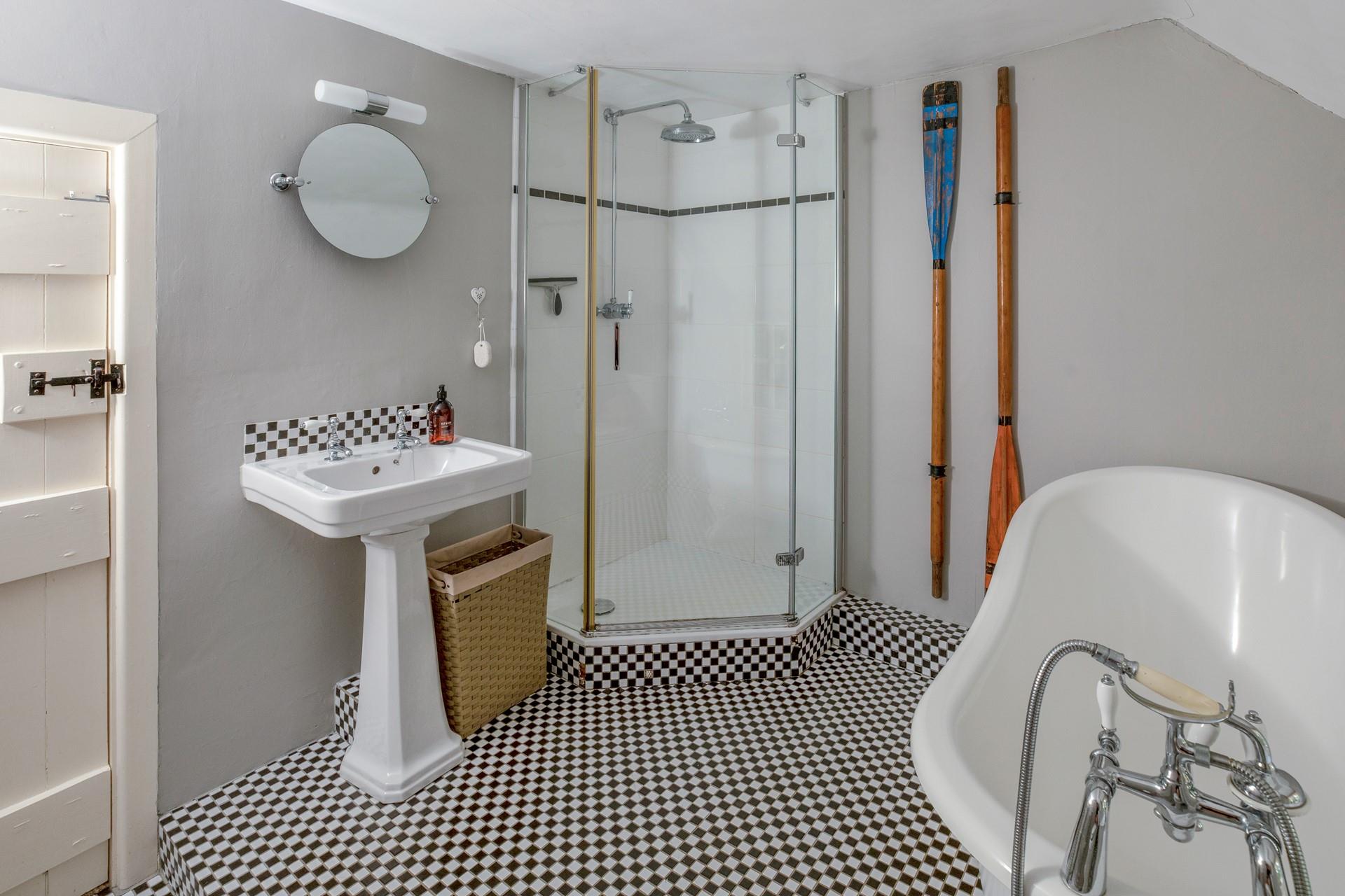 Wash off sandy toes in the shower after a day on Poldhu beach.