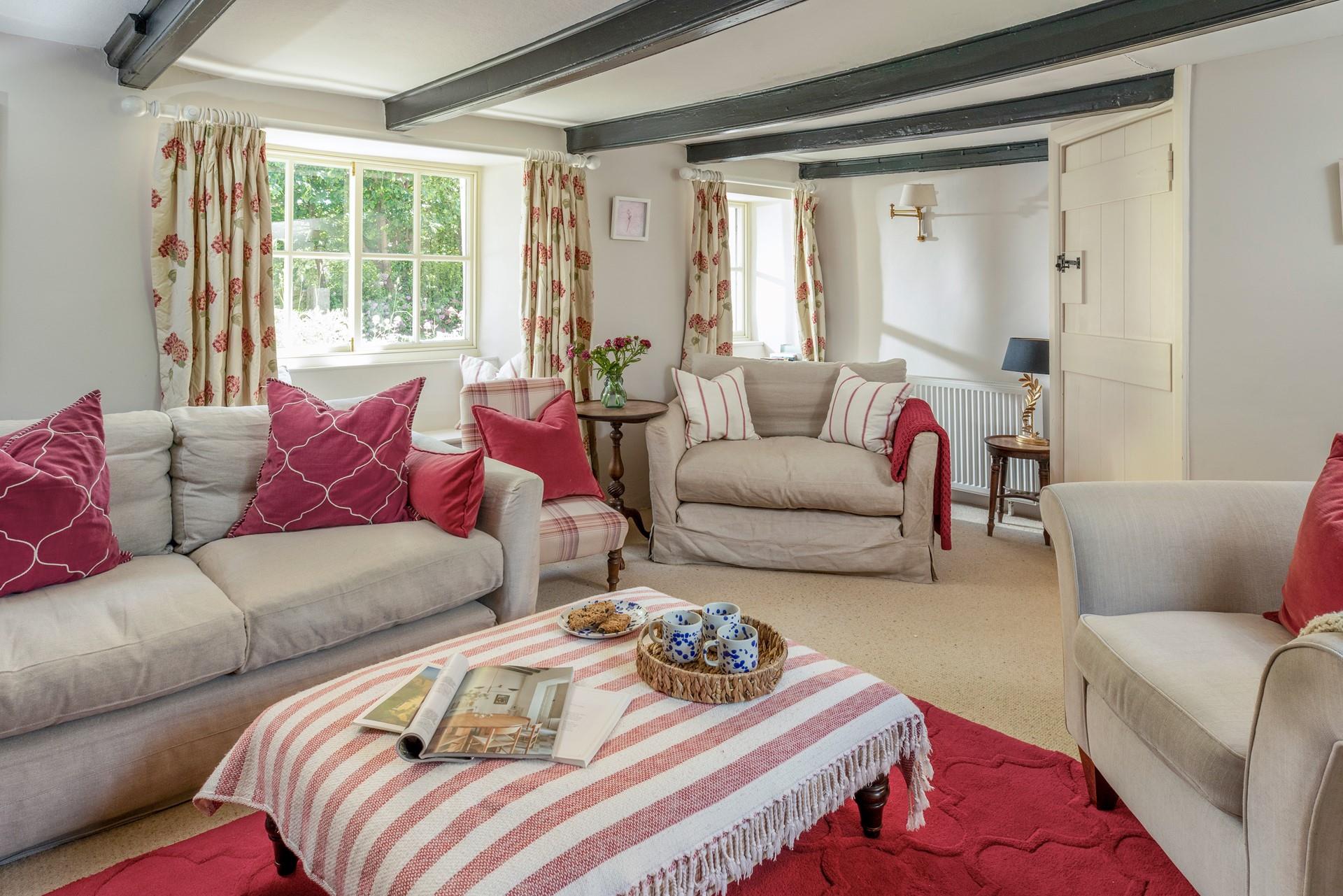 Sip a cuppa in the morning in the cosy cottage sitting room.