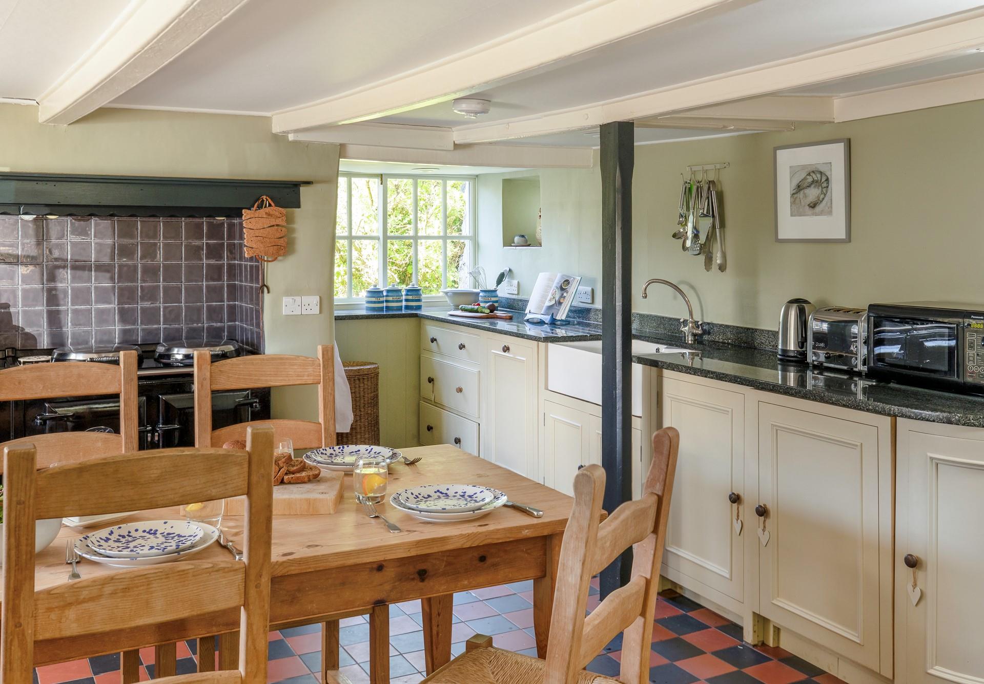 The kitchen is a beautiful blend of traditional cottage styling. 