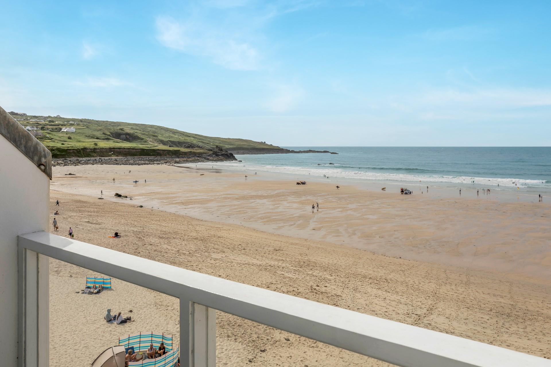 Spend the day on the beach and return to unwind on the balcony.