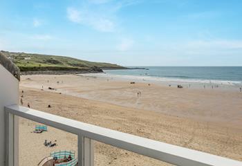 Spend the day on the beach and return to unwind on the balcony.