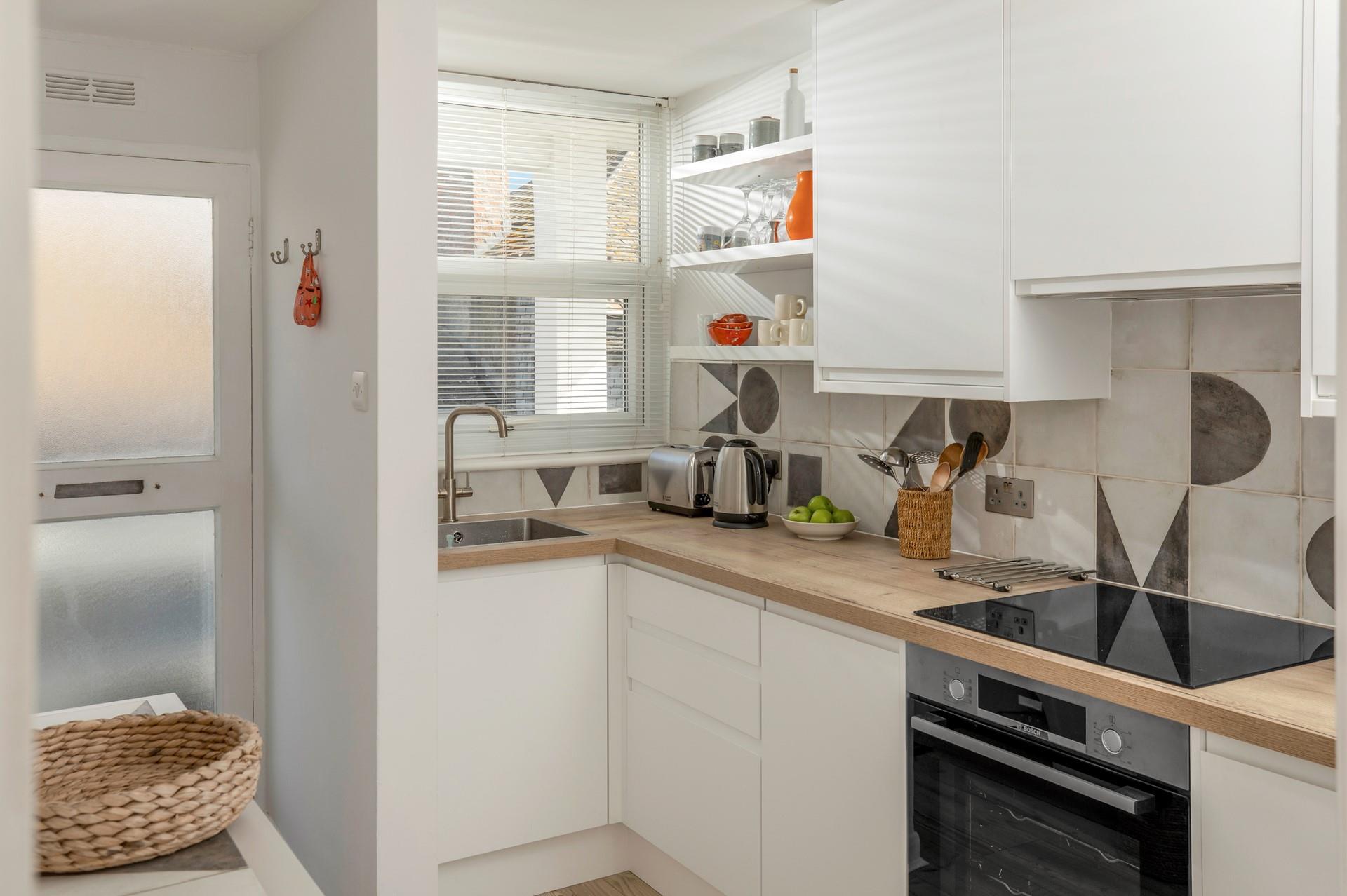 The kitchen is fully equipped for cooking tasty meals.