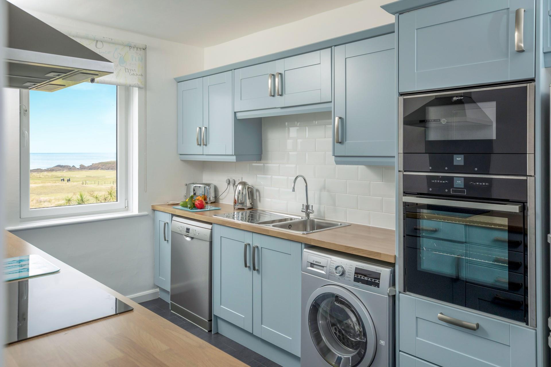 The kitchen is modern and well-equipped.