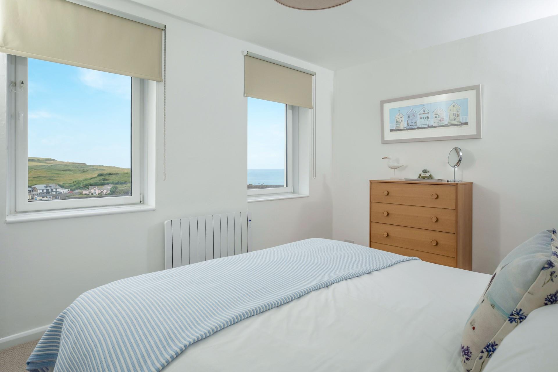 Open the blinds to see the ocean glistening in the morning sun.