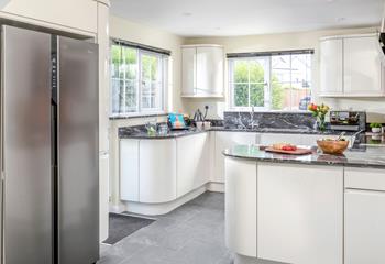 The kitchen is modern and spacious for cooking tasty meals.